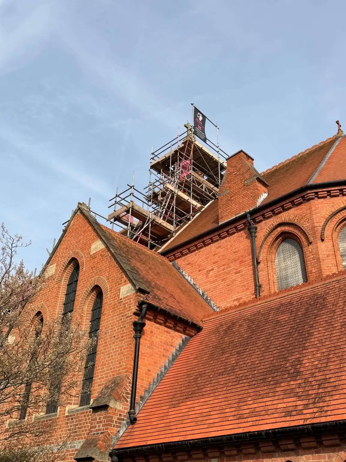 Scaffold rising above the roofline of the Grade II-listed St Luke's Church in Reading