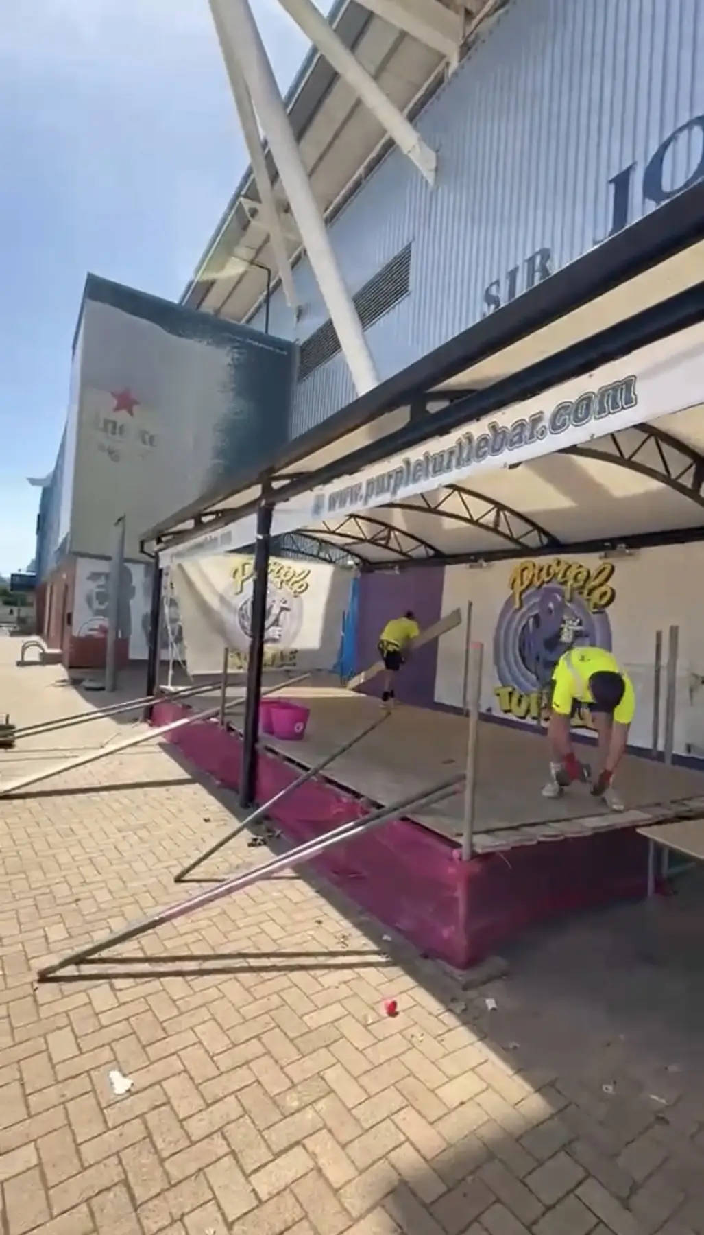 ROAR operatives dismantling the temporary scaffold stage outside the Madejski Stadium in Reading