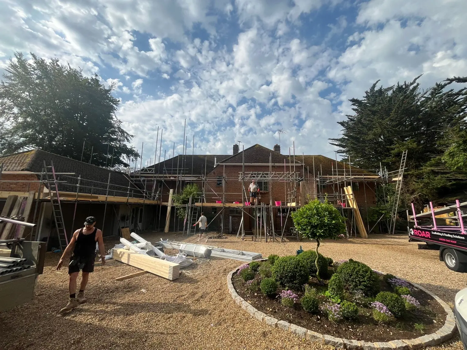 ROAR scaffold surrounding a large home and formal garden in Medmenham