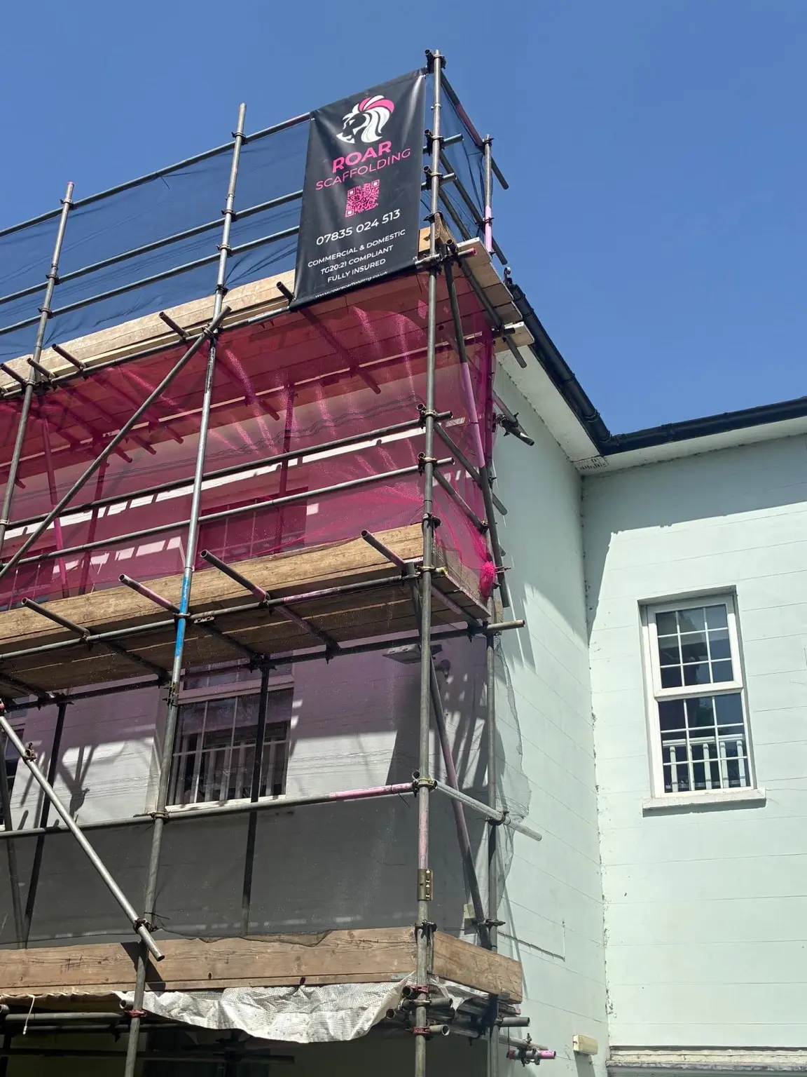 ROAR Scaffolding banner displayed on a netted commercial scaffold in Newbury
