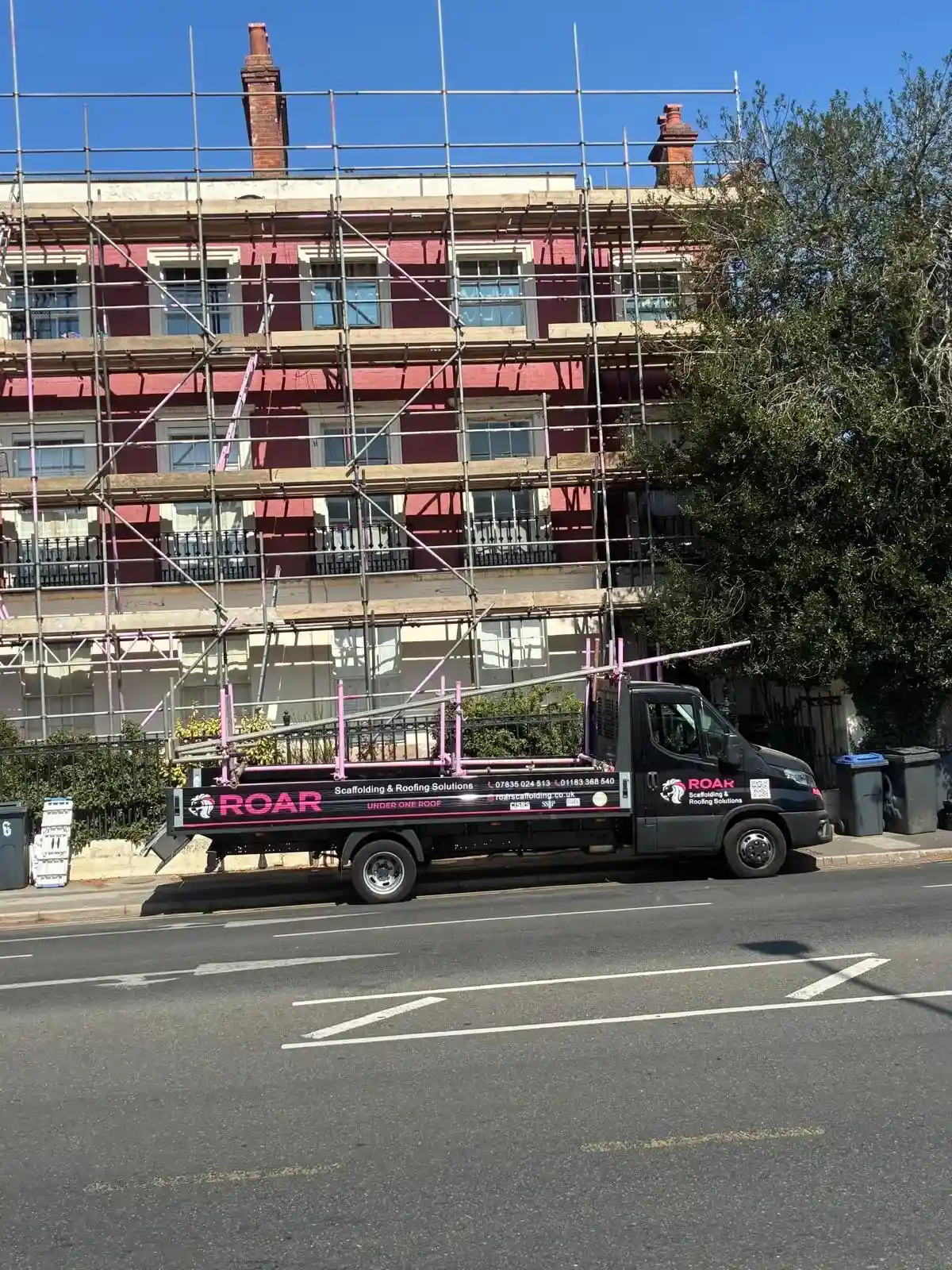 Scaffold reaching the chimneys and roofline of a period property in Reading