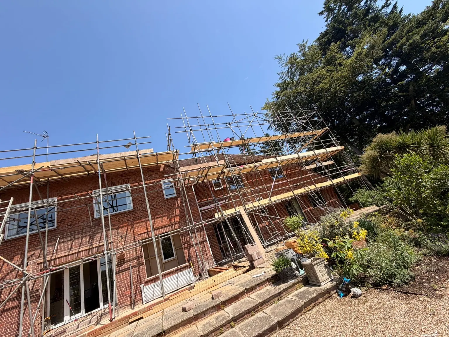 Multiple boarded working lifts across the principal elevation of the property