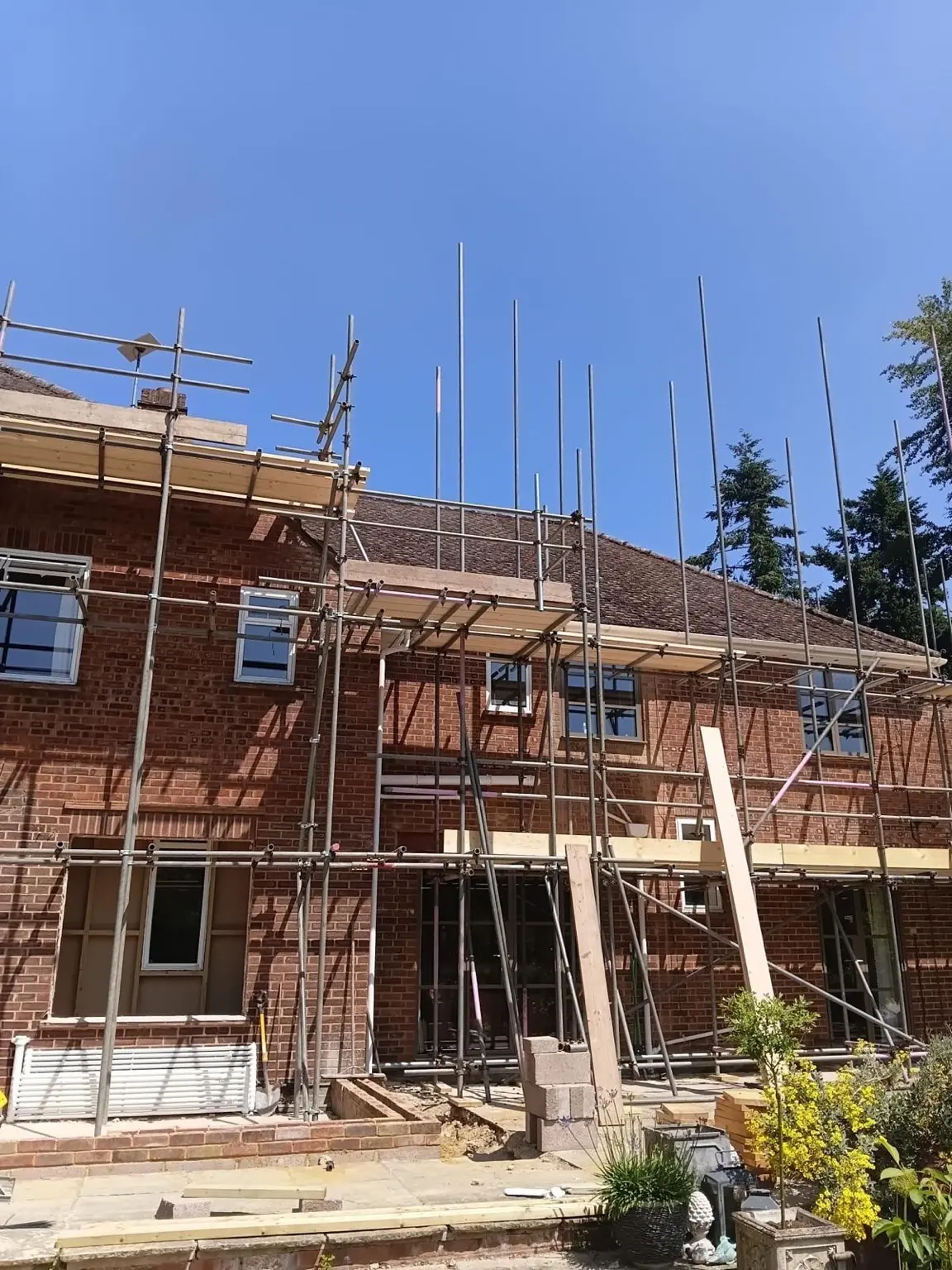 Scaffolding across the rear elevation during structural alterations and roof works
