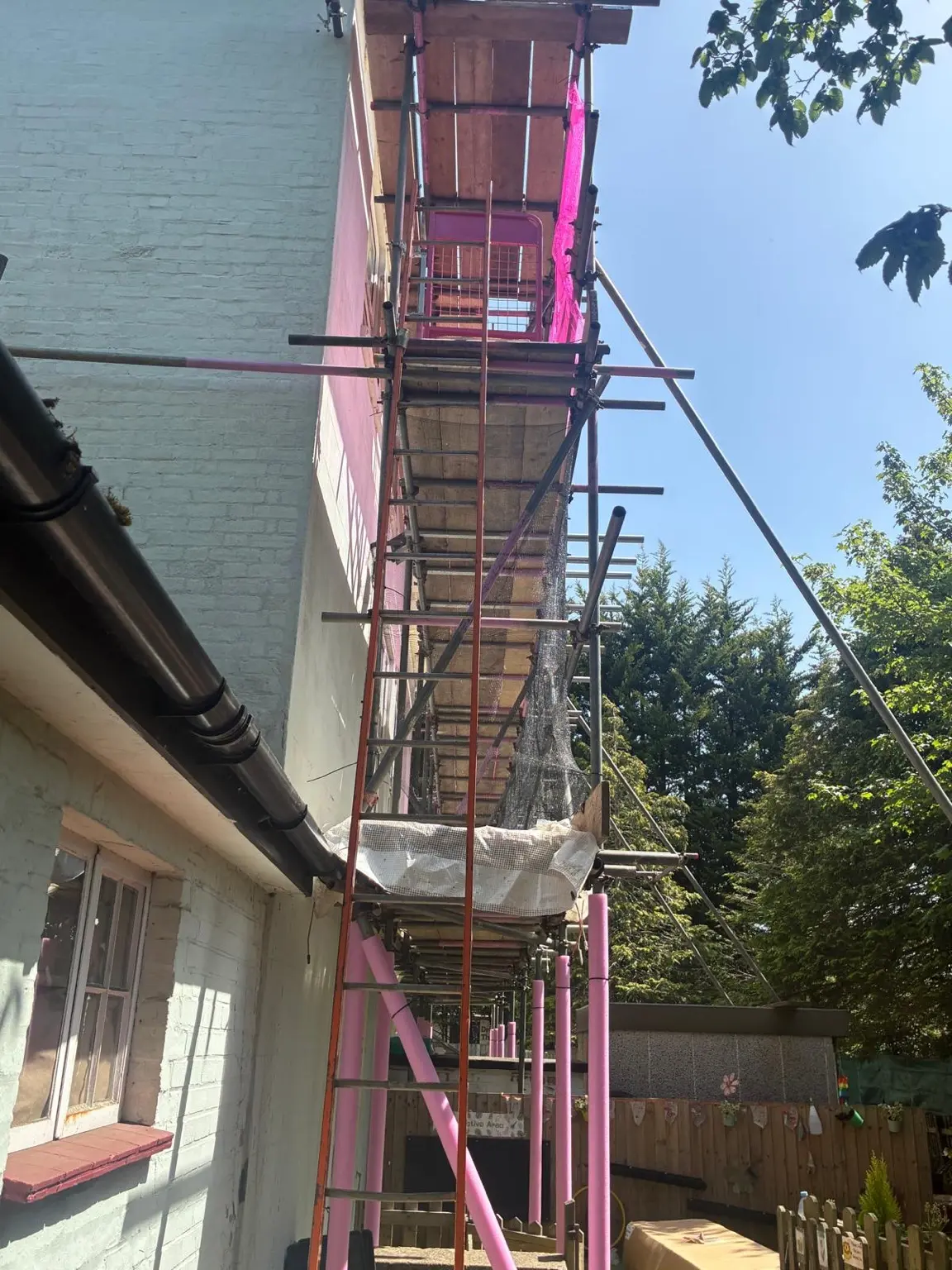 Designated ladder access serving the scaffold working platforms at a nursery