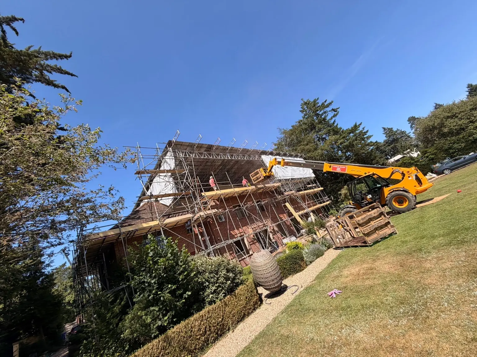 Scaffold and site plant supporting high-level roof construction at the Medmenham property