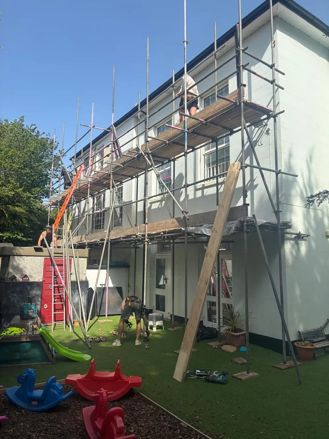 Boarded working lifts being installed across the nursery elevation